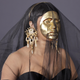 Image for article titled The Big Reveal: AMAs Fashion Was Wild, Wacky and...What Was Up With Cardi's Mask?